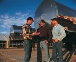 Men talking at a dairy operation